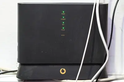 a black computer monitor with green lights on it at Catedral Reina Apartaments in Valencia