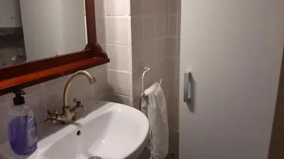 a bathroom with a white sink and a mirror at La Vía Verde in Jérica