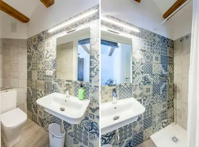 a bathroom with a sink and a toilet at ApartUP Central Market I in Valencia