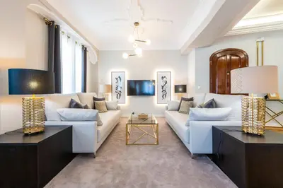 a living room with white furniture and a chandelier at MD Pasaje Ruzafa in Valencia