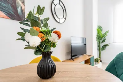 a vase filled with flowers sitting on a table at R&C APARTMENTS CLOSE to CENTER in Valencia