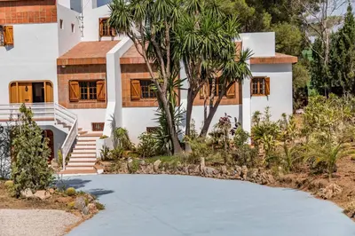 a house with a driveway in front of it at La Colina in Puebla de Vallbona