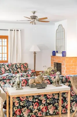 a living room with a couch and a table at La Colina in Puebla de Vallbona