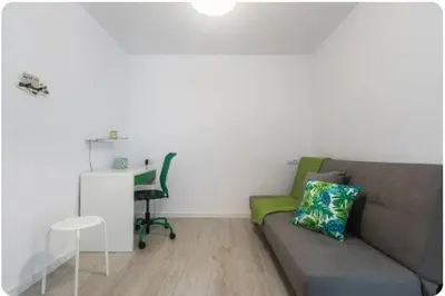 a living room with a couch and a desk at Islas Canarias Apartment in Valencia