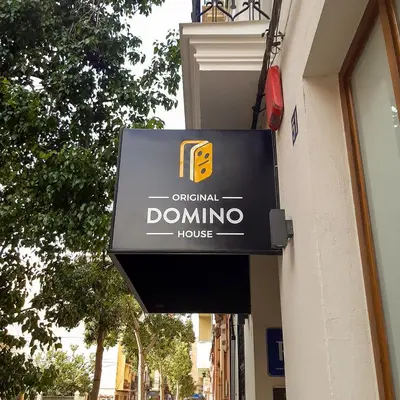a building with a sign on the side of it at Hotel Original Domino House in Valencia