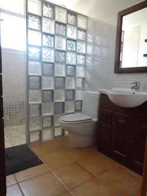 a bathroom with a toilet and a sink and a mirror at LAS PALOMAS, appartement 3 chambres avec piscine in Turís