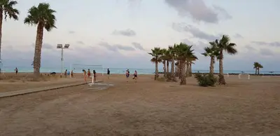 a group of people playing soccer on the beach at Apartamento Playa Moncofar - Xilxes in Moncófar
