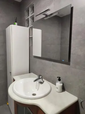 a bathroom with a white sink and a mirror at 150 Playa in Puerto de Sagunto