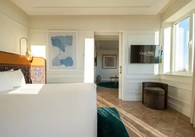 a hotel room with a bed and a television at Only YOU Hotel Valencia in Valencia
