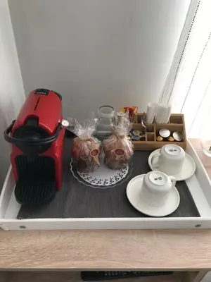 a counter with a coffee maker and food on it at Habitación en Casa Qerétaro in Silla