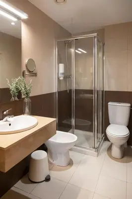 a bathroom with a shower and a toilet and a sink at Hideout 26 in Valencia