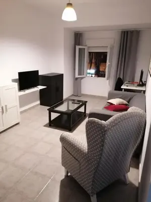 a living room with a couch and a table at Fully Furnished Double Room in Valencia