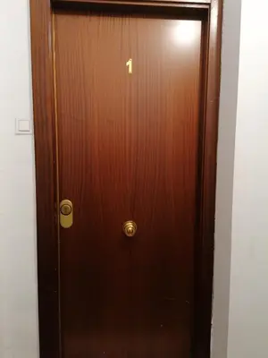 a wooden door with a number h on it at Fully Furnished Double Room in Valencia