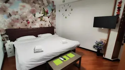 a bedroom with a bed with a flower wall at Terrasa de Mercado Central in Valencia