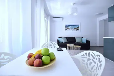 a bowl of fruit on a white table in a living room at Emma Apartment Central in Valencia