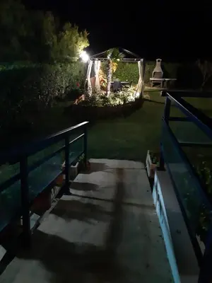a backyard at night with a gazebo at CANAL SALINAS Solo Familias Serviplaya in Casas Las Basas
