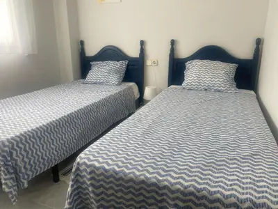 two beds sitting next to each other in a room at CANAL SALINAS Solo Familias Serviplaya in Casas Las Basas
