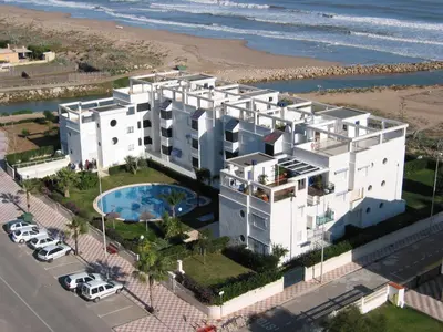 an aerial view of a large white building next to the beach at CANAL SALINAS Solo Familias Serviplaya in Casas Las Basas