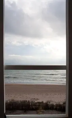 a view of the beach from a window at Beachfront House, Valencia, Wifi, Paddle Surf Board, Incredible Views in Sueca