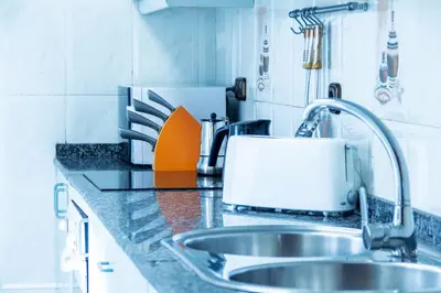 a kitchen counter with a sink and a toaster at Estudio para parejas con WIFI en la playa in Valencia