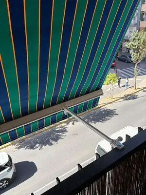 a car parked on a street under a bridge at Cosy flat with excellent location in Valencia! in Valencia