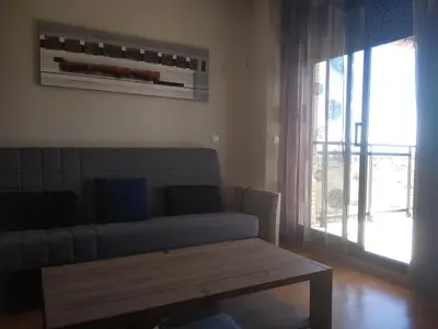 a living room with a couch and a coffee table at Apartamento Moncofar playa in Moncófar