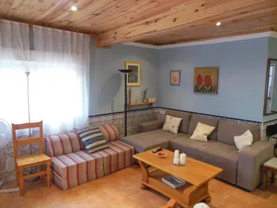 a living room with a couch and a table at Casa Blanca in Algimia de Alfara