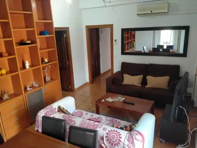 a living room with a couch and a table at Main Central Station Apartment in Valencia