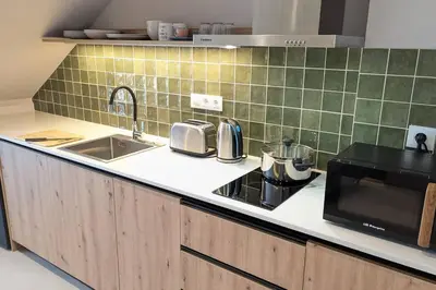 a kitchen with a sink and a microwave at Renovado Estudio privado en la playa in Valencia