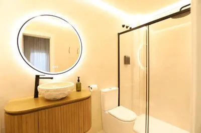 a bathroom with a sink and a mirror at Encantador apartamento junto al Mediterraneo by Hometels in Puerto de Sagunto