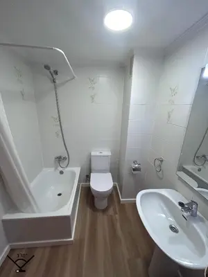 a bathroom with a tub and a toilet and a sink at Lovely 3-Bedroom Apartment 15 Minutes from Beach in Valencia