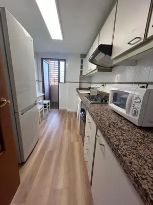 a kitchen with a counter top with a microwave at Lovely 3-Bedroom Apartment 15 Minutes from Beach in Valencia