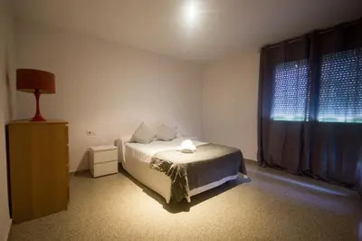 a bedroom with a bed and a window at Front Sun Beach Apartment in Valencia