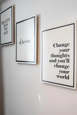 three framed pictures on a white wall at Versus Apartment City Center in Valencia