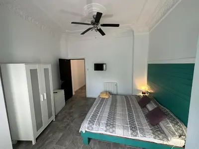 a bedroom with a bed and a ceiling fan at 5 minuts Ruzzafa, perfect locatión 6PX & Wifi in Valencia