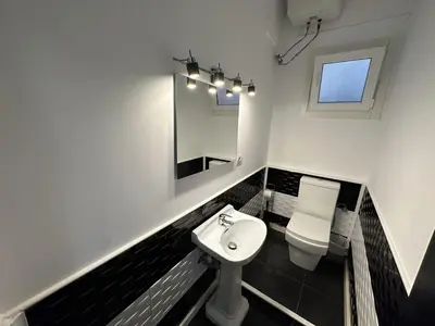 a bathroom with a sink and a toilet and a mirror at 5 minuts Ruzzafa, perfect locatión 6PX & Wifi in Valencia