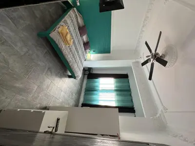 a room with a staircase with a ceiling fan at 5 minuts Ruzzafa, perfect locatión 6PX & Wifi in Valencia