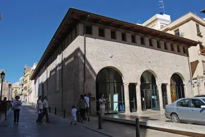 a group of people standing outside of a building at SH Suite Palace in Valencia