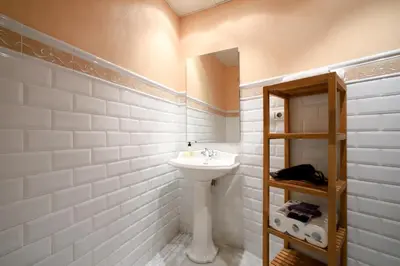a white bathroom with a sink and a mirror at Valencia Centro. Wifi/AACC Jacuzzi in Valencia