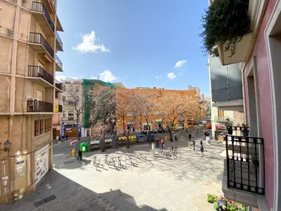 a view of a city street with people and buildings at Valencia Centro. Wifi/AACC Jacuzzi in Valencia