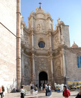 a group of people standing in front of a church at Travel Habitat Plaza de la Virgen in Valencia