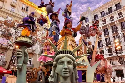 a statue in front of a building with people on it at Lovely Modern Flat Valencia center in Valencia