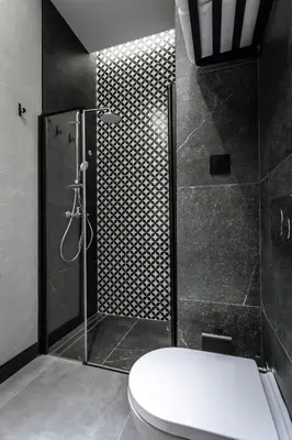 a bathroom with a shower and a toilet in it at PAMPHYLIA HOTEL in Valencia