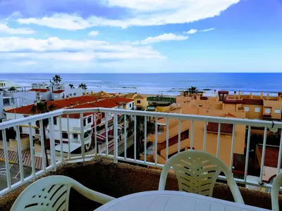 a balcony with chairs and a view of the ocean at Parquemar I Solo Familias Serviplaya in Casas Las Basas