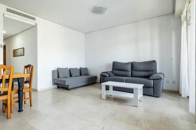 a living room with a couch and a table at Bet Apartments - Sunrise Beach Apartments in Valencia