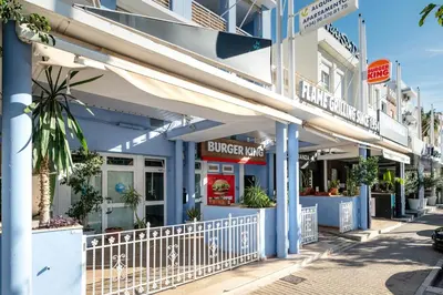 a building with a burger king sign on a street at Bet Apartments - Sunrise Beach Apartments in Valencia