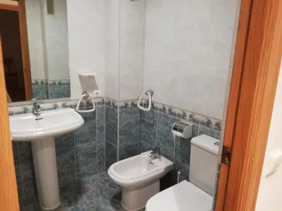 a bedroom with a bed and a large window at Parquemar III-IV Solo Familias!!! Serviplaya in Casas Las Basas