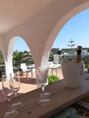 a table with two glasses and a bottle of wine at Casa Loro Loco B&B in Pedralba