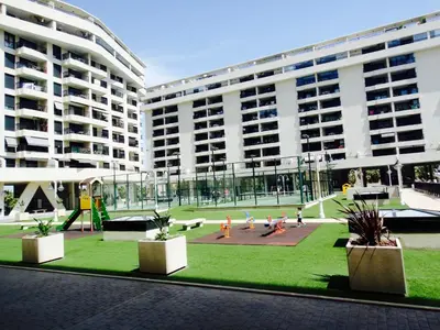 a large building with a park in front of it at Patacona Beach Power!! in Valencia