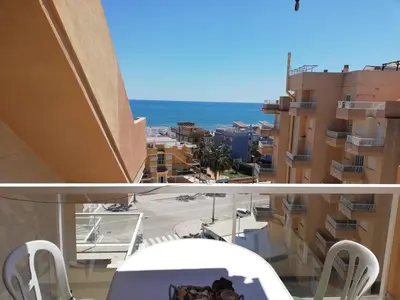 a view of the ocean from a balcony of a building at Los Naranjos Solo Familias in Casas Las Basas